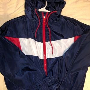 red blue and white zip up hooded windbreaker